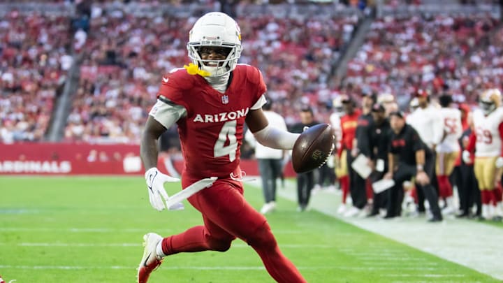 Jan 5, 2025; Glendale, Arizona, USA; Arizona Cardinals wide receiver Greg Dortch (4) scores a touchdown against the San Francisco 49ers in the second half at State Farm Stadium. Mandatory Credit: Mark J. Rebilas-Imagn Images Jan 5, 2025; Glendale, Arizona, USA; Arizona Cardinals wide receiver Greg Dortch (4) scores a touchdown against the San Francisco 49ers in the second half at State Farm Stadium. Mandatory Credit: Mark J. Rebilas-Imagn Images