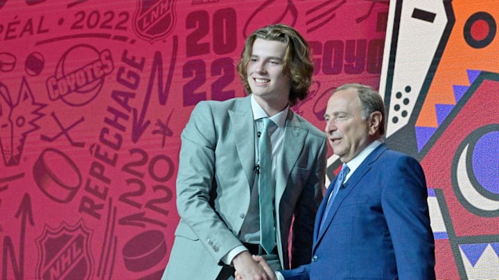 Jul 7, 2022; Montreal, Quebec, CANADA; Conor Geekie shakes hands with NHL commissioner Gary Bettman after being selected as the number eleven overall pick to the Arizona Coyotes in the first round of the 2022 NHL Draft at Bell Centre. Mandatory Credit: Eric Bolte-Imagn Images