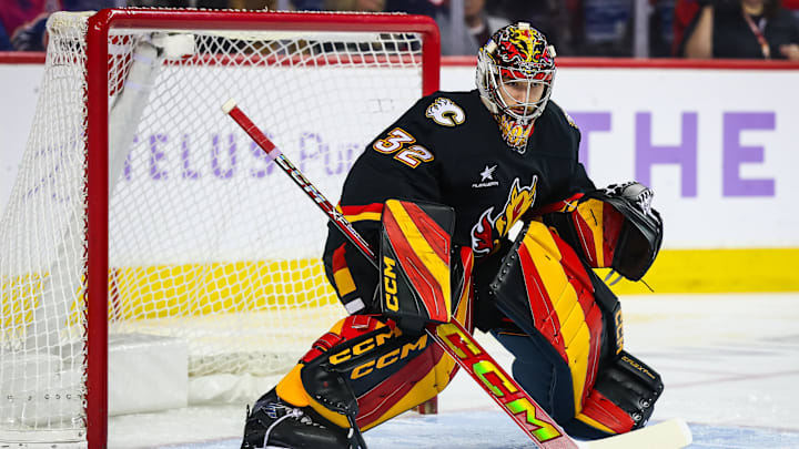 Nov 21, 2024; Calgary, Alberta, CAN; Calgary Flames goaltender Dustin Wolf (32) guards his net against the New York Rangers during the first period at Scotiabank Saddledome. Mandatory Credit: Sergei Belski-Imagn Images
