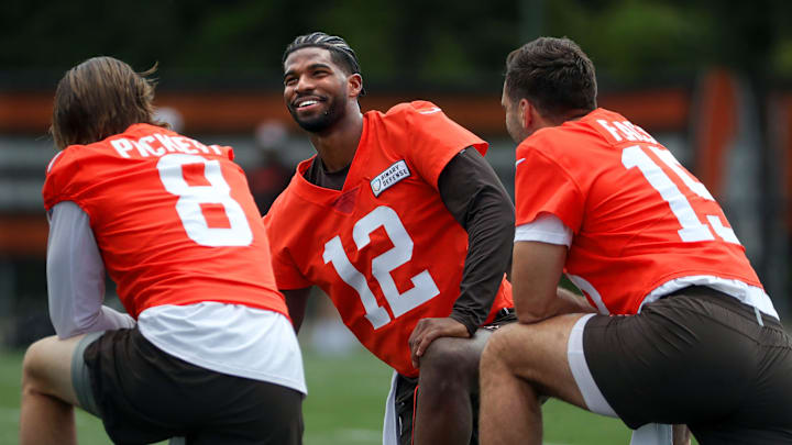 Browns quarterbacks Shedeur Sanders (12), Kenny Pickett (8) and Joe Flacco (15) talk during minicamp, Tuesday, June 10, 2025, in Berea.