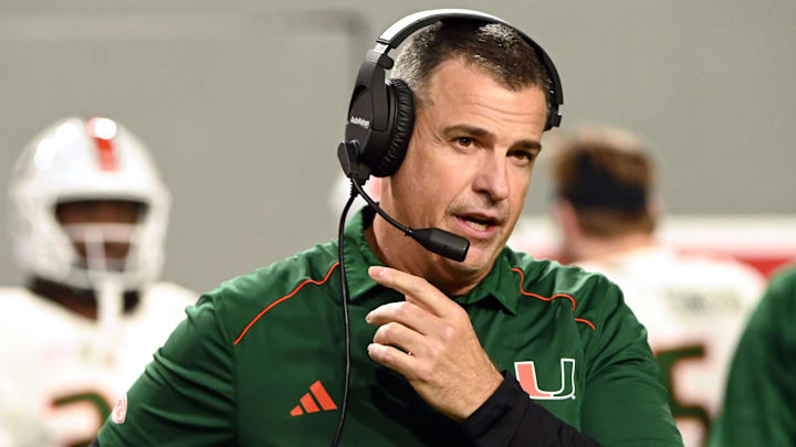 Nov 4, 2023; Raleigh, North Carolina, USA; Miami Hurricanes head coach Mario Cristobal looks on during the first half against the North Carolina State Wolfpack at Carter-Finley Stadium. Mandatory Credit: Rob Kinnan-Imagn Images