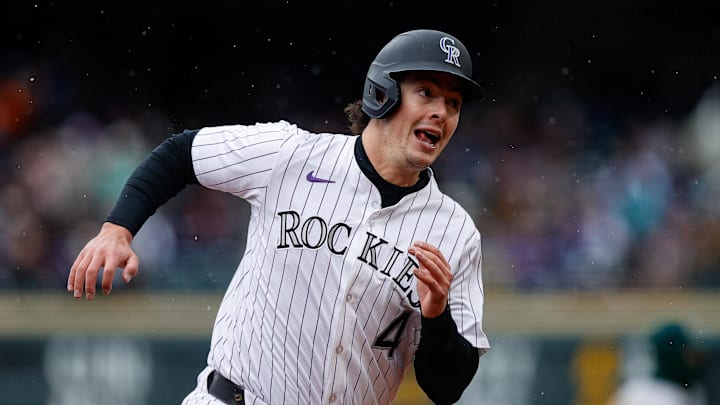 Apr 4, 2025; Denver, Colorado, USA; Colorado Rockies first baseman Michael Toglia (4) rounds third on an RBI in the fourth inning against the Athletics at Coors Field. Mandatory Credit: Isaiah J. Downing-Imagn Images