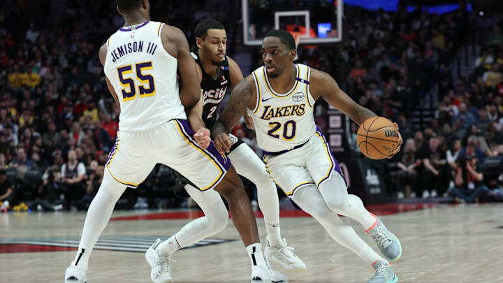 Apr 13, 2025; Portland, Oregon, USA; Los Angeles Lakers guard Shake Milton (20) dribbles the ball around his teammate Lakers’ center Trey Jemison III (55) past Portland Trail Blazers forward Kris Murray (24) in the second half at Moda Center. Mandatory Credit: Jaime Valdez-Imagn Images Apr 13, 2025; Portland, Oregon, USA; Los Angeles Lakers guard Shake Milton (20) dribbles the ball around his teammate Lakers’ center Trey Jemison III (55) past Portland Trail Blazers forward Kris Murray (24) in the second half at Moda Center. Mandatory Credit: Jaime Valdez-Imagn Images
