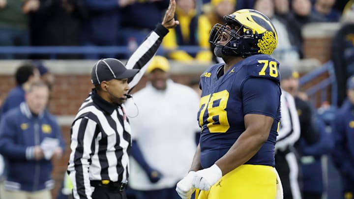 Nov 23, 2024; Ann Arbor, Michigan, USA;  Michigan Wolverines defensive lineman Kenneth Grant (78) celebrates after sacking Northwestern Wildcats quarterback Jack Lausch (not pictured) in the first half at Michigan Stadium. Mandatory Credit: Rick Osentoski-Imagn Images