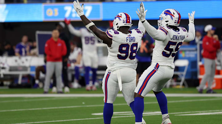Dec 23, 2023; Inglewood, California, USA;  Buffalo Bills defensive tackle Poona Ford (98) celebrates with defensive end Kingsley Jonathan (59) 