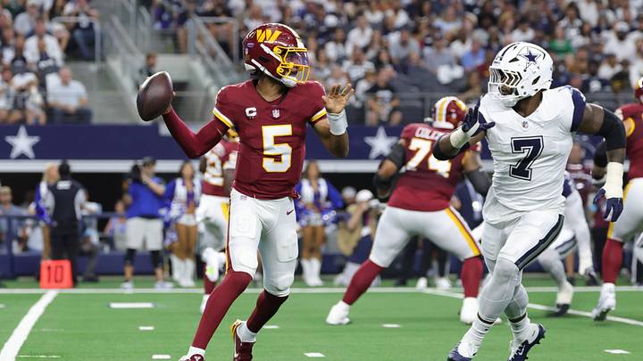 Sep 20, 2026; Arlington, Texas, USA; Washington Commanders quarterback Jayden Daniels (5) scrambles against Dallas Cowboys linebacker Rashan Gary (7) during the first half at AT&T Stadium. Mandatory Credit: Kevin Jairaj-Imagn Images Sep 20, 2026; Arlington, Texas, USA; Washington Commanders quarterback Jayden Daniels (5) scrambles against Dallas Cowboys linebacker Rashan Gary (7) during the first half at AT&T Stadium. Mandatory Credit: Kevin Jairaj-Imagn Images