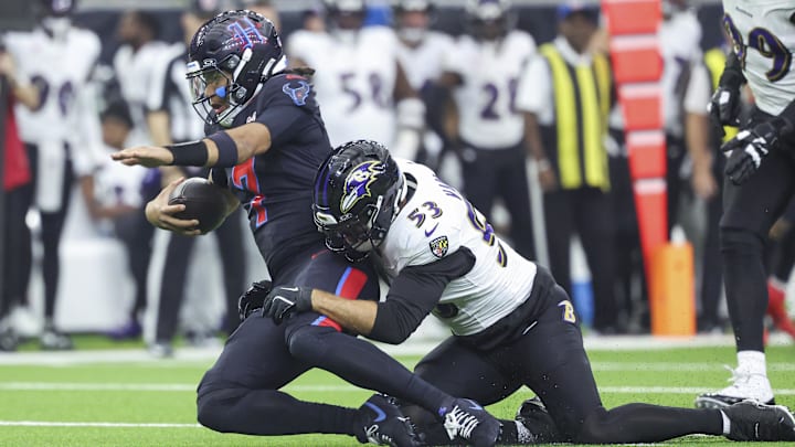 Dec 15, 2024; Houston, Texas, USA; Baltimore Ravens linebacker Kyle Van Noy (53) sacks Houston Texans quarterback C.J. Stroud (7) during the first quarter at NRG Stadium. Mandatory Credit: Troy Taormina-Imagn Images
