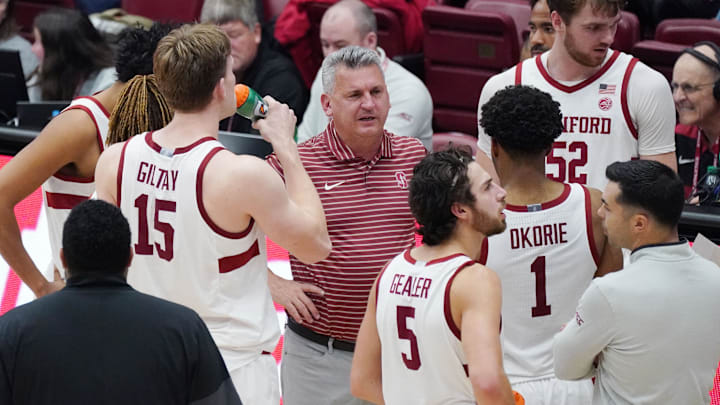Dec 7, 2025; Stanford, California, USA;  Stanford Cardinal head coach Kyle Smith talks with forward/center Oskar Giltay (15), guard Benny Gealer (5), guard Ebuka Okorie (1), and forward/center Aidan Cammann (52) during a break in the action in the second half against the UNLV Runnin' Rebels at Maples Pavilion. Mandatory Credit: David Gonzales-Imagn Images