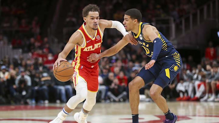 Mar 13, 2022; Atlanta, Georgia, USA; Atlanta Hawks guard Trae Young (11) is defended by Indiana