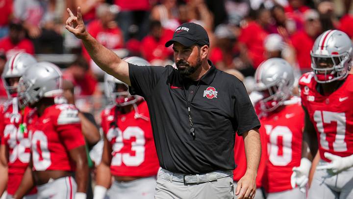 Ohio State Buckeyes head coach Ryan Day leads warm-ups prior to the college football game at Ohio Stadium in Columbus. Ohio State Buckeyes head coach Ryan Day leads warm-ups prior to the college football game at Ohio Stadium in Columbus.