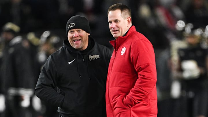 Nov 28, 2025; West Lafayette, Indiana, USA;  Purdue Boilermakers head coach Barry Odom and Indiana Hoosiers head coach Curt Cignetti speak before the game at Ross-Ade Stadium. Mandatory Credit: Marc Lebryk-Imagn Images