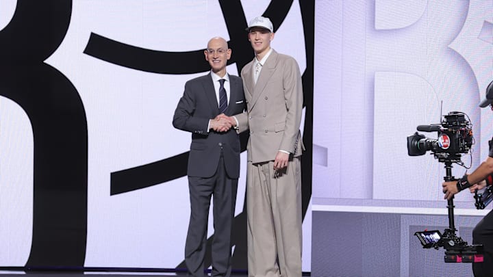 Jun 25, 2025; Brooklyn, NY, USA;  Egor Demin stands with NBA commissioner Adam Silver after being selected as the eighth pick by the Brooklyn Nets in the first round of the 2025 NBA Draft at Barclays Center. Mandatory Credit: Brad Penner-Imagn Images