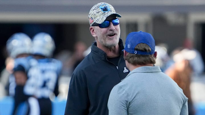Carolina Panthers head coach and former Indianapolis Colts head coach Frank Reich (left) talks with Indianapolis Colts general manager Chris Ballard on Sunday, Nov. 5, 2023, before a game against the Carolina Panthers at Bank of America Stadium in Charlotte. Carolina Panthers head coach and former Indianapolis Colts head coach Frank Reich (left) talks with Indianapolis Colts general manager Chris Ballard on Sunday, Nov. 5, 2023, before a game against the Carolina Panthers at Bank of America Stadium in Charlotte.