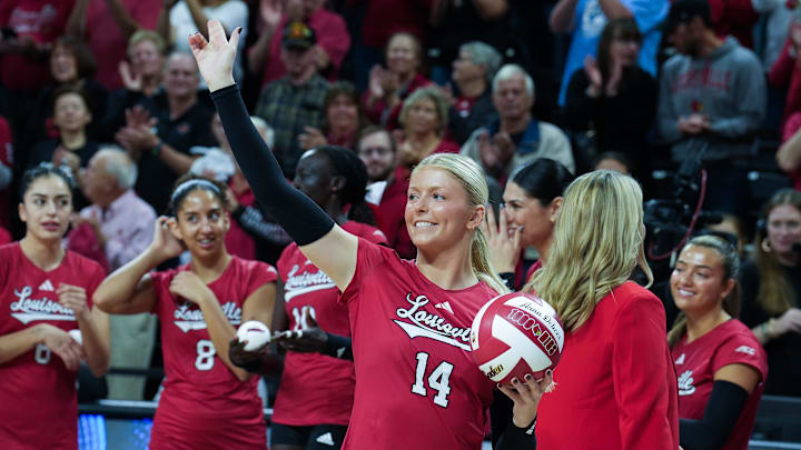 Louisville volleyball senior Elena Scott (19) was honored with a 1000 Dig ball ahead of their match against North Carolina at the L&N Arena in Louisville, Ky. on Nov. 18, 2024. The Cards swept North Carolina in 3 sets on senior day.