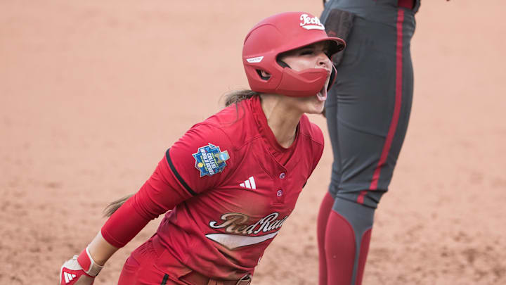 Jun 2, 2025; Oklahoma City, OK, USA;  Texas Tech Red Raiders outfielder Demi Elder (2) yells after hitting a triple and driving in a run in the second inning against the Oklahoma Sooners during the NCAA Softball Women's College World Series semifinal game at Devon Park. Mandatory Credit: Brett Rojo-Imagn Images