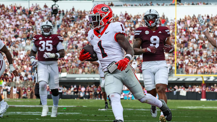 Nov 8, 2025; Starkville, Mississippi, USA; Georgia Bulldogs wide receiver Zachariah Branch (1) runs with the ball for a touchdown against the Mississippi State Bulldogs during the first half at Davis Wade Stadium at Scott Field. Mandatory Credit: Wesley Hale-Imagn Images