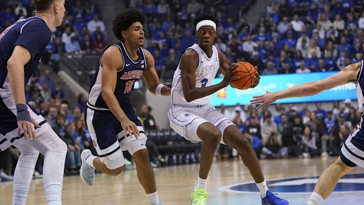 Jan 26, 2026; Provo, Utah, USA; BYU Cougars forward AJ Dybantsa (3) controls the ball while being defended by Arizona Wildcats forward Koa Peat (10) during the first half  at Marriott Center. Mandatory Credit: Aaron Baker-Imagn Images 