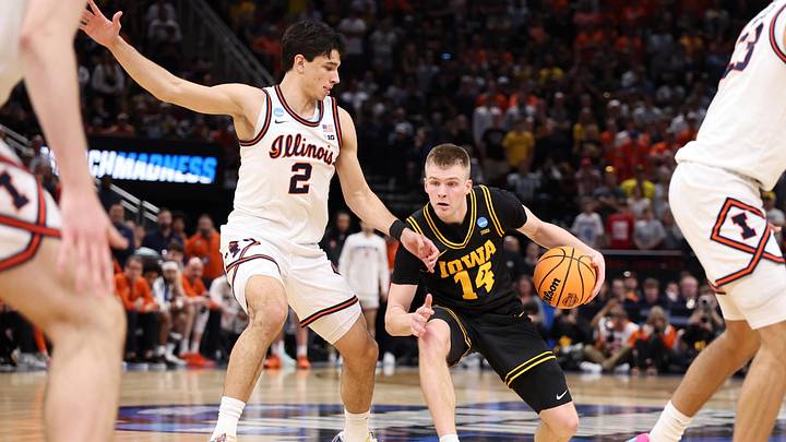 Mar 28, 2026; Houston, TX, USA; Iowa Hawkeyes guard Bennett Stirtz (14) controls the ball against Illinois Fighting Illini guard Andrej Stojakovic (2) in the second half during an Elite Eight game of the South Regional of the men's 2026 NCAA Tournament at Toyota Center. Mandatory Credit: Troy Taormina-Imagn Images