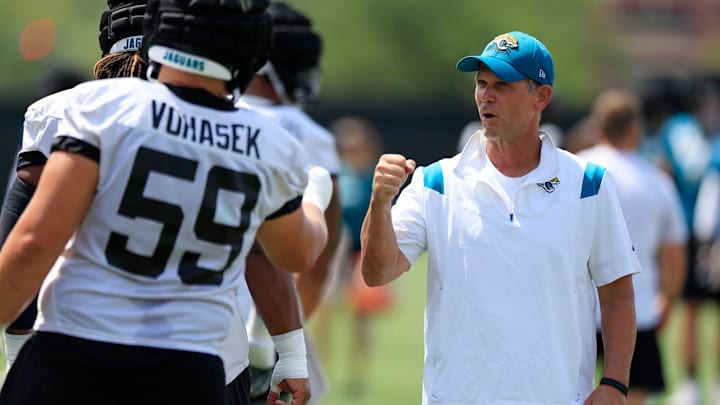 Jacksonville Jaguars defensive tackle Raymond Vohasek (59) fist bumps general manager Trent Baalke