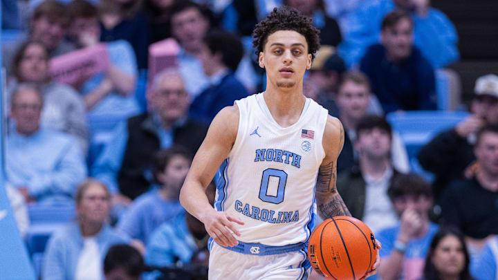 Dec 22, 2025; Chapel Hill, North Carolina, USA; North Carolina Tar Heels guard Kyan Evans (0) brings the ball up court against the East Carolina Pirates during the second half at Dean E. Smith Center. Mandatory Credit: Scott Kinser-Imagn Images