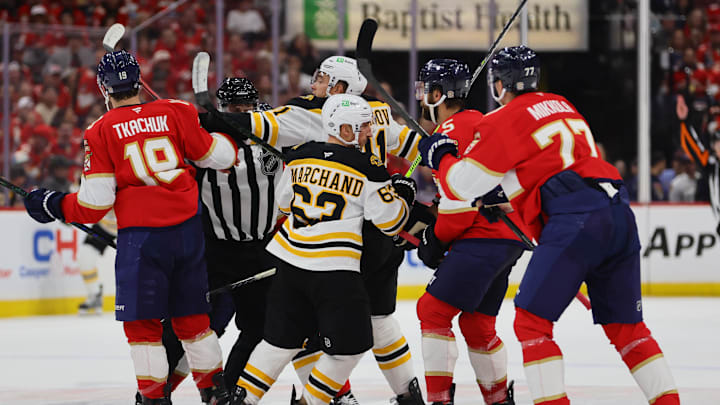 Oct 8, 2024; Sunrise, Florida, USA; Florida Panthers left wing Matthew Tkachuk (19) and Boston Bruins center Trent Frederic (11) push each other during the first period at Amerant Bank Arena. Mandatory Credit: Sam Navarro-Imagn Images
