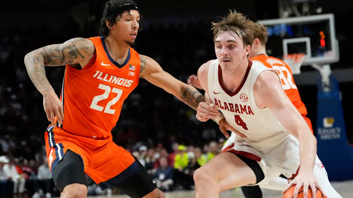 Nov 20, 2024; Birmingham, AL, USA; Illinois guard Trey White (22) defends as Alabama forward Grant Nelson (4) drives with the ball in the CM Newton Classic at Legacy Arena. Mandatory Credit: Gary Cosby Jr.-Tuscaloosa News