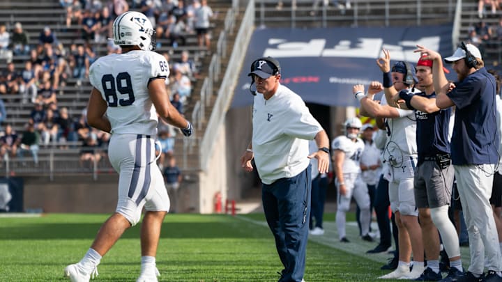 Yale Bulldogs head coach Tony Reno congratulates Yale Bulldogs tight end D. Major Roman (89)