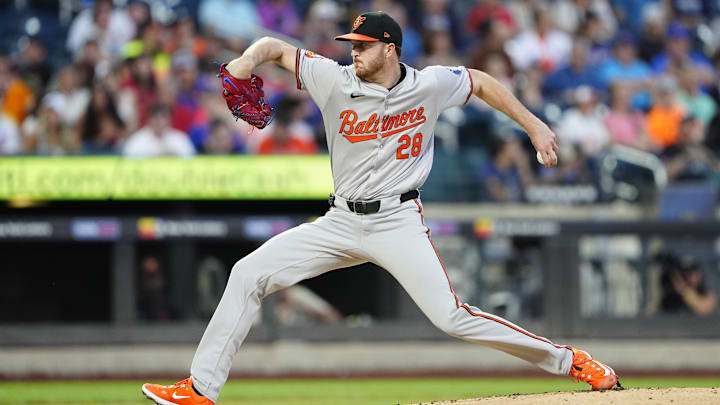 Aug 19, 2024; New York City, New York, USA; Baltimore Orioles pitcher Trevor Rogers (28) delivers a pitch against the New York Mets during the first inning at Citi Field.