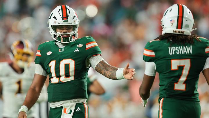 Sep 26, 2026; Miami Gardens, Florida, USA; Miami Hurricanes quarterback Darian Mensah (10) celebrates with wide receiver Daylyn Upshaw (7) against the Central Michigan Chippewas during the third quarter at Hard Rock Stadium. Mandatory Credit: Sam Navarro-Imagn Images
