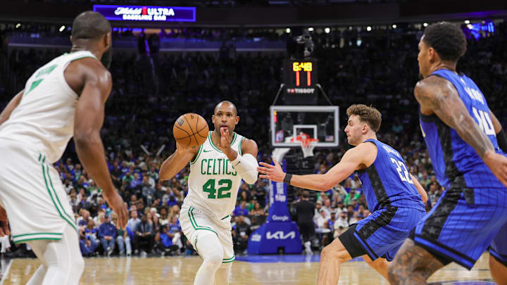Apr 25, 2025; Orlando, Florida, USA; Boston Celtics center Al Horford (42) passes the ball against Orlando Magic forward Franz Wagner (22) during the second half of game three of first round for the 2024 NBA Playoffs at Kia Center. Mandatory Credit: Mike Watters-Imagn Images Apr 25, 2025; Orlando, Florida, USA; Boston Celtics center Al Horford (42) passes the ball against Orlando Magic forward Franz Wagner (22) during the second half of game three of first round for the 2024 NBA Playoffs at Kia Center. Mandatory Credit: Mike Watters-Imagn Images