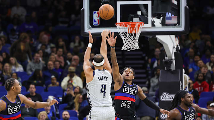 Orlando Magic guard Jalen Suggs (4) shoots the ball against Detroit Pistons guard Marcus Sasser (25) during the second quarter at Kia Center.