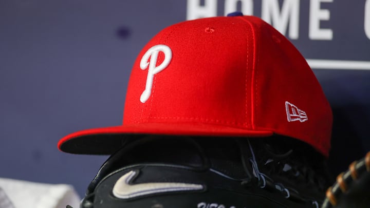 May 26, 2023; Atlanta, Georgia, USA; A detailed view of a Philadelphia Phillies hat and glove on the bench against the Atlanta Braves in the seventh inning at Truist Park. May 26, 2023; Atlanta, Georgia, USA; A detailed view of a Philadelphia Phillies hat and glove on the bench against the Atlanta Braves in the seventh inning at Truist Park.