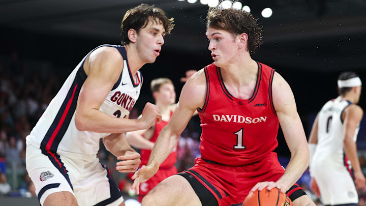 Davidson Wildcats forward Reed Bailey (1) dribbles as Gonzaga Bulldogs forward Braden Huff (34) defends during the second half at Imperial Arena at the Atlantis resort. Davidson Wildcats forward Reed Bailey (1) dribbles as Gonzaga Bulldogs forward Braden Huff (34) defends during the second half at Imperial Arena at the Atlantis resort.