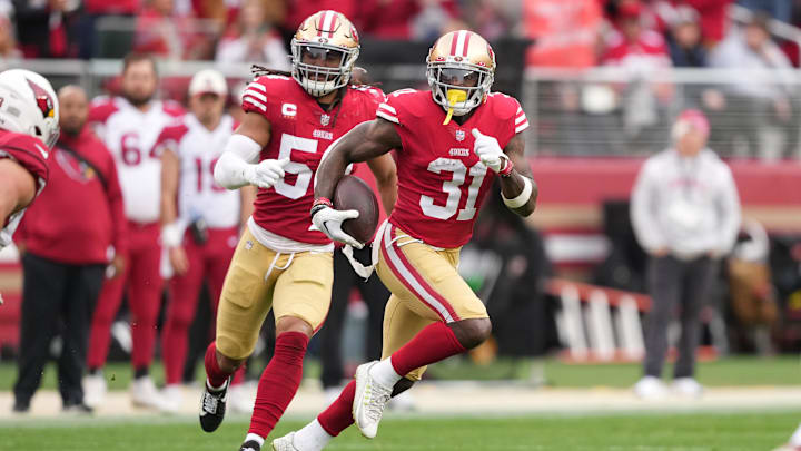 Jan 8, 2023; Santa Clara, California, USA; San Francisco 49ers safety Tashaun Gipson Sr. (31) returns an interception against the Arizona Cardinals during the third quarter at Levi's Stadium.
