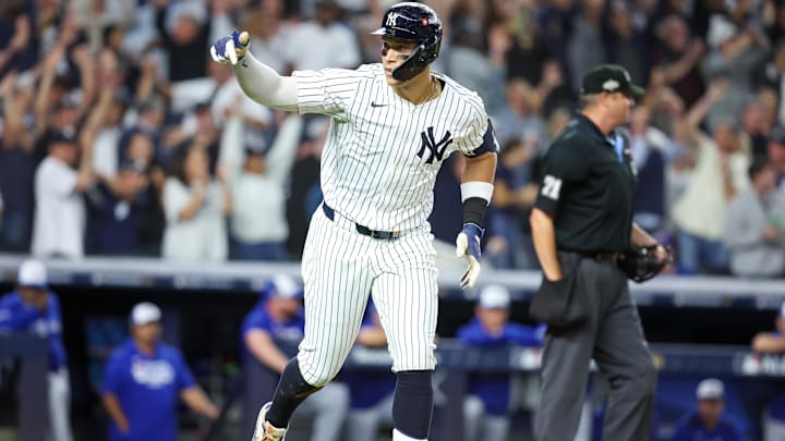 Oct 7, 2025; Bronx, New York, USA; New York Yankees outfielder Aaron Judge (99) reacts after hitting a three-run home run in the fourth inning against the Toronto Blue Jays during game three of the ALDS round for the 2025 MLB playoffs at Yankee Stadium. Mandatory Credit: Wendell Cruz-Imagn Images