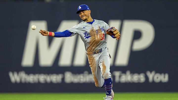 Apr 26, 2024; Toronto, Ontario, CAN; Los Angeles Dodgers shortstop Mookie Betts (50) throws to first against the Toronto Blue Jays during the sixth inning at Rogers Centre. Apr 26, 2024; Toronto, Ontario, CAN; Los Angeles Dodgers shortstop Mookie Betts (50) throws to first against the Toronto Blue Jays during the sixth inning at Rogers Centre.