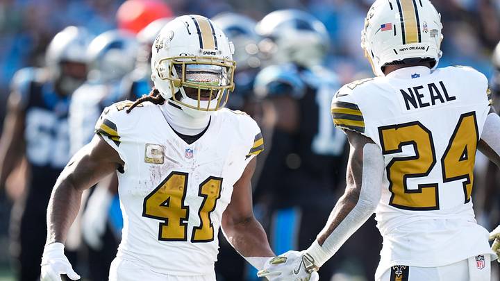 Nov 9, 2025; Charlotte, North Carolina, USA; New Orleans Saints running back Alvin Kamara (41) high fives New Orleans Saints running back Devin Neal (24) during the second quarter against the Carolina Panthers at Bank of America Stadium. Mandatory Credit: Jim Dedmon-Imagn Images