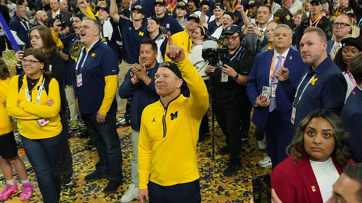 Apr 6, 2026; Indianapolis, IN, USA; Michigan Wolverines head coach Dusty May watches One Shining Moment after defeating the Connecticut Huskies in the national championship of the Final Four of the men's 2026 NCAA Tournament at Lucas Oil Stadium. Mandatory Credit: Robert Deutsch-Imagn Images
