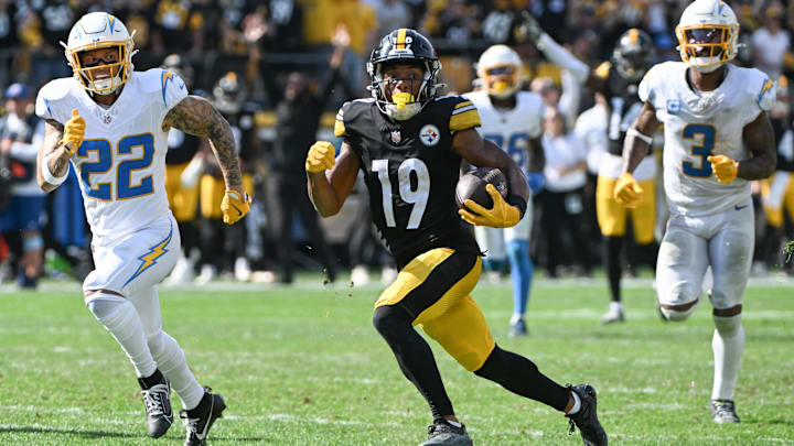 Sep 22, 2024; Pittsburgh, Pennsylvania, USA; Pittsburgh Steelers wide receiver Calvin Austin III (19) scores a touchdown while being chased by Los Angeles Chargers cornerback Elijah Molden (22) during the fourth quarter at Acrisure Stadium. Mandatory Credit: Barry Reeger-Imagn Images