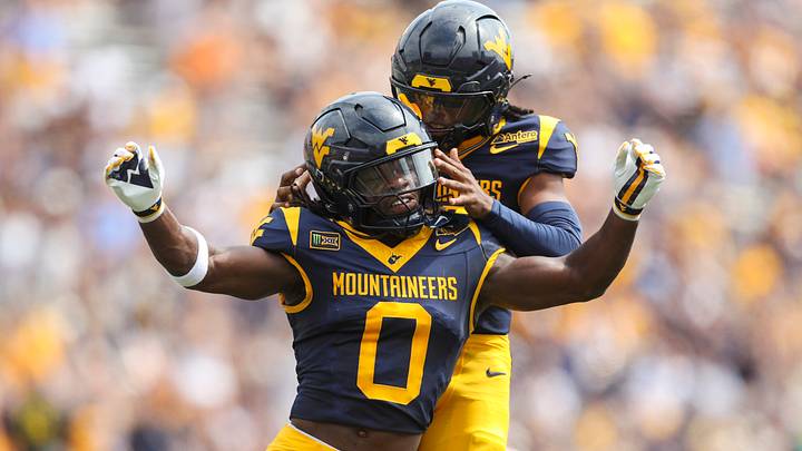 Sep 12, 2026; Morgantown, West Virginia, USA;  West Virginia Mountaineers safety Andrew Powdrell (0) celebrates after a punt block with West Virginia Mountaineers defensive back Jaire Rawlison (22) during the first quarter against the UT Martin Skyhawks at Milan Puskar Stadium.  Mandatory Credit: Ben Queen-Imagn Images