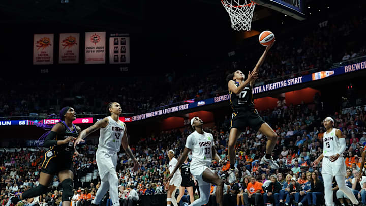 Sep 1, 2025; Uncasville, Connecticut, USA; Connecticut Sun guard Leila Lacan (47) scores against  Atlanta Dream guard Maya Caldwell (33) in the second half at Mohegan Sun Arena.