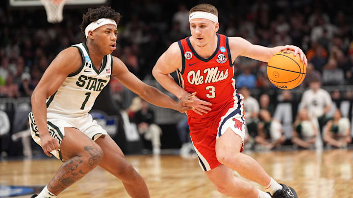 Mar 28, 2025; Atlanta, GA, USA; Mississippi Rebels guard Sean Pedulla (3) drives against Michigan State Spartans guard Jeremy Fears Jr. (1) in the second half of a South Regional semifinal of the 2025 NCAA tournament at State Farm Arena. Mandatory Credit: Dale Zanine-Imagn Images