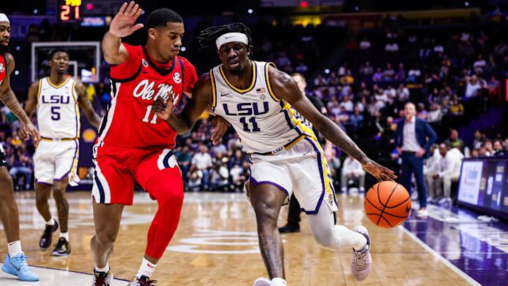 Feb 8, 2025; Baton Rouge, Louisiana, USA; LSU Tigers forward Corey Chest (11) dribbles against Mississippi Rebels guard Matthew Murrell (11) during the first half at Pete Maravich Assembly Center. Mandatory Credit: Stephen Lew-Imagn Images Feb 8, 2025; Baton Rouge, Louisiana, USA; LSU Tigers forward Corey Chest (11) dribbles against Mississippi Rebels guard Matthew Murrell (11) during the first half at Pete Maravich Assembly Center. Mandatory Credit: Stephen Lew-Imagn Images