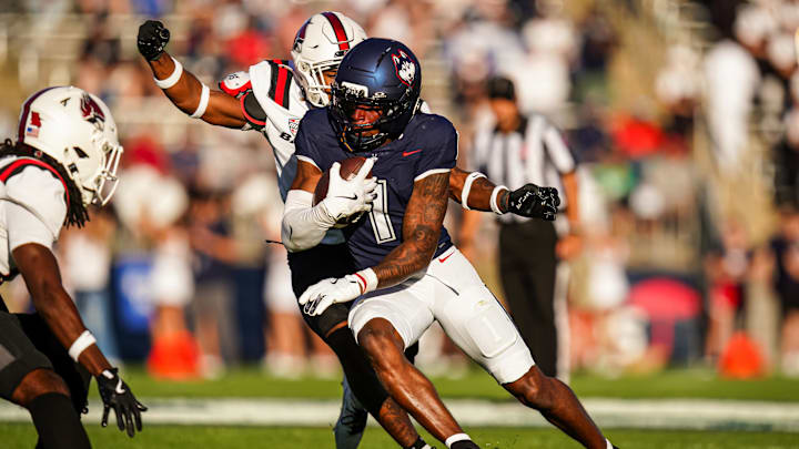 Sep 20, 2025; East Hartford, Connecticut, USA; Connecticut Huskies wide receiver Skyler Bell (1) runs the ball against the Ball State Cardinals in the second half at Pratt & Whitney Stadium at Rentschler Field. Mandatory Credit: David Butler II-Imagn Images Sep 20, 2025; East Hartford, Connecticut, USA; Connecticut Huskies wide receiver Skyler Bell (1) runs the ball against the Ball State Cardinals in the second half at Pratt & Whitney Stadium at Rentschler Field. Mandatory Credit: David Butler II-Imagn Images
