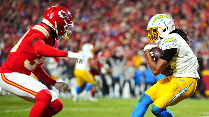 Dec 8, 2024; Kansas City, Missouri, USA; Los Angeles Chargers wide receiver Quentin Johnston (1) catches a touchdown pass against Kansas City Chiefs cornerback Keith Taylor Jr. (39) during the second half at GEHA Field at Arrowhead Stadium. Mandatory Credit: Jay Biggerstaff-Imagn Images Dec 8, 2024; Kansas City, Missouri, USA; Los Angeles Chargers wide receiver Quentin Johnston (1) catches a touchdown pass against Kansas City Chiefs cornerback Keith Taylor Jr. (39) during the second half at GEHA Field at Arrowhead Stadium. Mandatory Credit: Jay Biggerstaff-Imagn Images