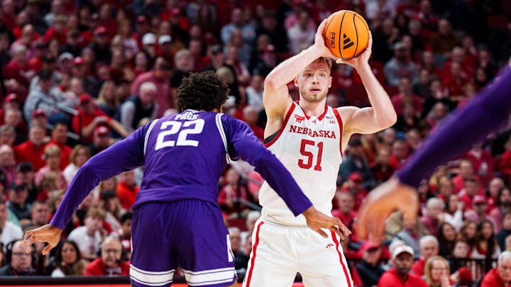 Nebraska forward Rienk Mast looks to pass against Northwestern forward Arrinten Page during the first half at Pinnacle Bank Arena.