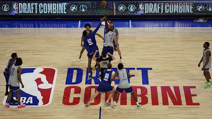 May 14, 2024; Chicago, IL, USA; Adam Bona (90) and Urich Chomche (62) go for a jump ball during the 2024 NBA Draft Combine  at Wintrust Arena. Mandatory Credit: David Banks-Imagn Images