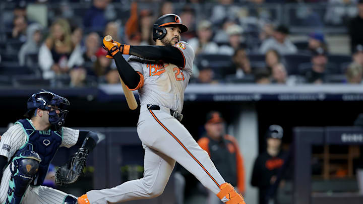 Sep 25, 2024; Bronx, New York, USA; Baltimore Orioles right fielder Anthony Santander (25) follows through on an RBI double against the New York Yankees during the fourth inning at Yankee Stadium.