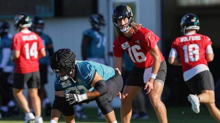 Jul 24, 2025; Jacksonville, FL, USA; Jacksonville Jaguars quarterback Trevor Lawrence (16) and center Robert Hainsey (73) participate in training camp at Miller Electric Center. Mandatory Credit: Nathan Ray Seebeck-Imagn Images