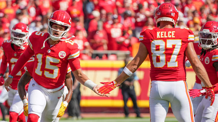 Sep 15, 2024; Kansas City, Missouri, USA; Kansas City Chiefs quarterback Patrick Mahomes (15) greets tight end Travis Kelce (87) during player introductions against the Cincinnati Bengals prior to a game at GEHA Field at Arrowhead Stadium. Mandatory Credit: Denny Medley-Imagn Images
